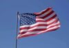 Arena Boos Ignite Reese Firestorm Waving American flag against a clear blue sky