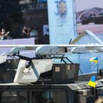 Killer Drones Reshape War Overnight Military drone mounted on armored vehicle
