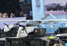 Military drone mounted on armored vehicle