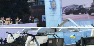 Military drone mounted on armored vehicle
