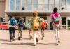 Record-Low Crime? Kids Keep Getting Shot Group of schoolchildren with backpacks running toward a school entrance