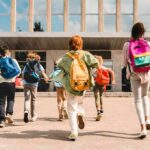 Record-Low Crime? Kids Keep Getting Shot Group of schoolchildren with backpacks running toward a school entrance