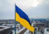 Massive Fraud Alarm Hits Ukraine Aid Ukrainian flag over snowy cityscape