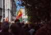 Crowd with Spanish flags in a city street