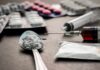Border Poison Pipeline — DEA’s Staggering Haul Spoon with white powder beside syringe and tablets