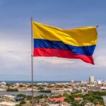 Stolen Votes? Petro Drops Explosive Claim Colombian flag waving over a coastal city skyline