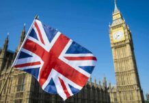 UK Hands Out Consent Pamphlets—Why Now? Union Jack flag with Elizabeth Tower in the background