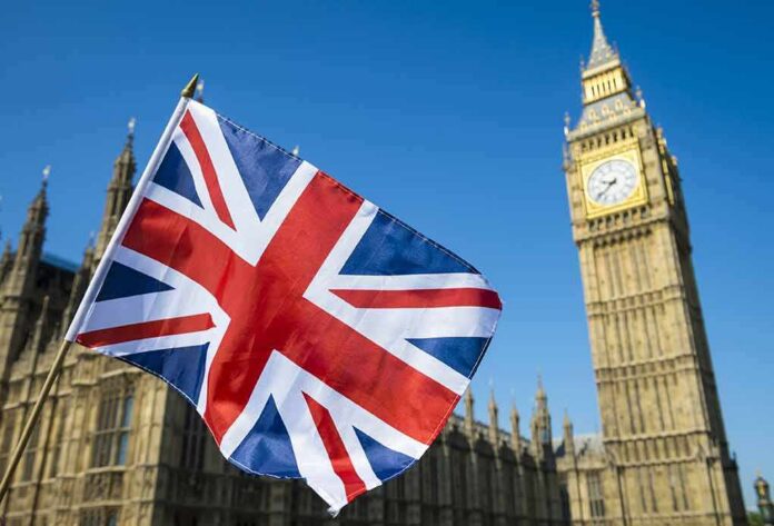 shutterstock_636097766 Union Jack flag with Elizabeth Tower in the background