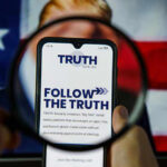 Paywall For The President? Premium Access To Power Phone screen displaying Truth Social app magnified