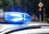 Democrat House Candidate Slams Into Parked Cars Police car blue siren light flashing