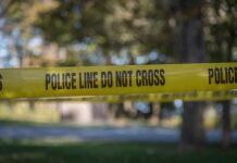 58 Victims Flagged – Five Women Feared Dead yellow police tape cordoning off an outdoor area