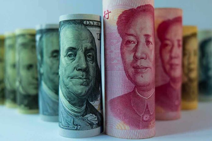 shutterstock_1064716769 Rolled banknotes with portraits standing upright