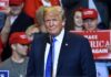 China Arms Tease – Hard Prohibition Stands Donald Trump at a rally speaking at a microphone