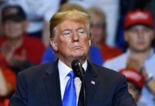 Donald Trump at a podium during a rally