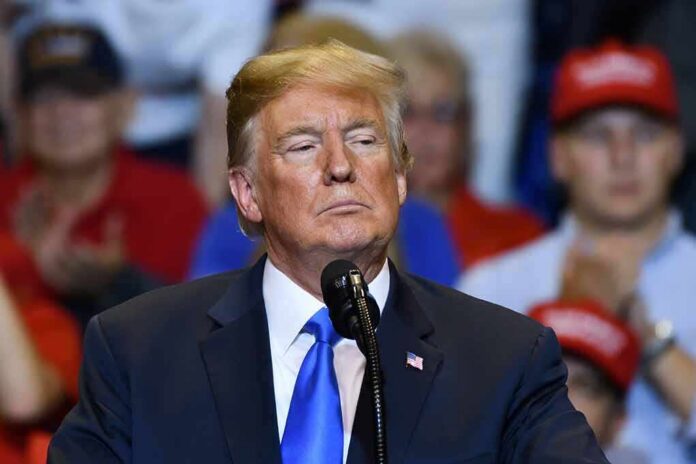 shutterstock_1157861293 Donald Trump at a podium during a rally
