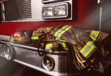 Fake Training Horror Rocks Firehouse Firefighter gear on the front of a fire truck