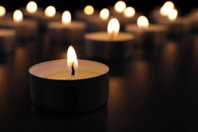 shutterstock_1189298020 Tealight candle burning with soft glow
