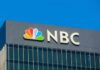 Media Ethics Bombshell: NBC’s Greenspan Dilemma NBC logo on a modern office building facade