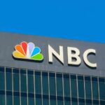Media Ethics Bombshell: NBC’s Greenspan Dilemma NBC logo on a modern office building facade