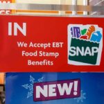 Food Stamp Trafficking Crackdown Hits NYC store door sign indicating EBT SNAP acceptance