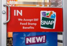 Food Stamp Trafficking Crackdown Hits NYC store door sign indicating EBT SNAP acceptance