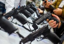 Handguns on display at a store counter