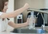 Abortion Drugs in Our Tap Water? EPA Launches Sweep Girl filling a glass with water at a kitchen sink