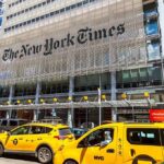 New York Times building with yellow taxis in front