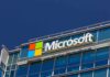 Microsoft Draws Red Line: Human Override Or Scrap The AI Microsoft logo on a modern corporate building against a blue sky