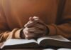 Christian Mom Triumphs – Oregon Backs Down Hands clasped over an open book