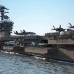 Aircraft carrier at sea with fighter jets on deck