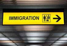 Risky Detours: DHS Workaround Sparks Fury Immigration sign with arrow in airport