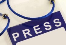 Court Order Ignored? Xi Dinner Meltdown Press badge with blue lanyard