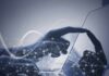 Digital Trail Exposes Chilling Father Plot Hand touching a tablet screen with abstract network overlay