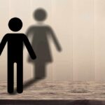 Justice Dept Forces Stunning Mount Sinai Pivot male stick figure casting a female-shaped shadow