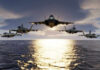 Anglo-French Nuke Run Raises Eyebrows Five jets flying low over the ocean at sunset.