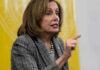 Nancy Pelosi speaking and gesturing with a pointed finger