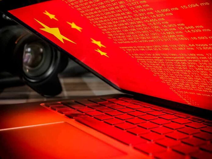 Laptop with red screen showing code and yellow stars