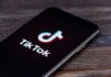 Creepy ‘Demonologist’ Sparks Privacy Panic smartphone displaying the TikTok app logo on screen