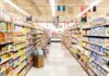 A grocery store aisle filled with various food products on shelves