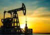 Oil pumpjack silhouette at sunset