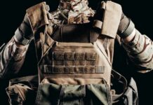 Soldier adjusting tactical plate carrier vest