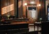 Empty courtroom with wooden benches and judge's bench
