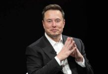 Hulk Star Sparks Musk Voting Panic Elon Musk seated in a black suit with hands clasped