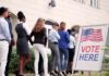 voters standing in line outside a polling place