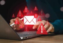 VPPA Trapdoor: Newsletter Clicks Trigger Lawsuit Minefield? person using laptop with email alert icons