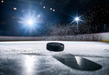 Heat Protocols Ignored? ASU Scrambles Hockey puck skimming across ice under arena lights