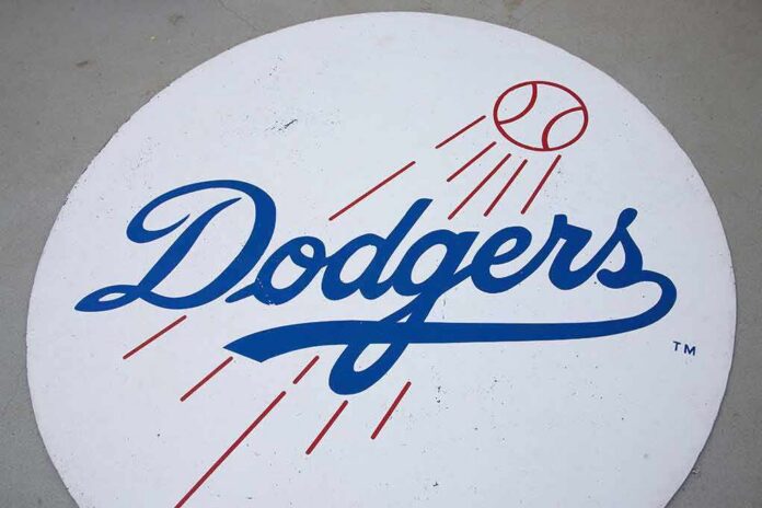 Dodgers logo with baseball and motion lines