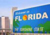 Welcome to Florida sign with city skyline in background
