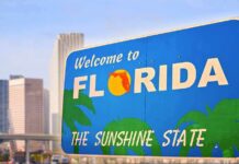 Welcome to Florida sign with city skyline in background